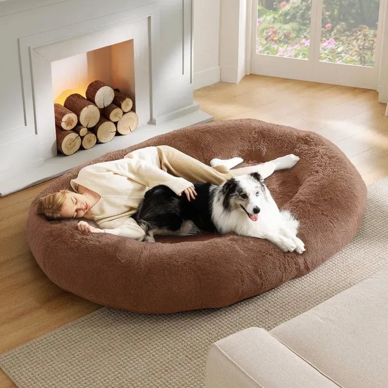 cozy brown human pet bed with person and dog relaxing together
