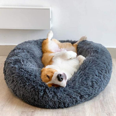 Dark gray anti-anxiety calming dog bed in a donut shape