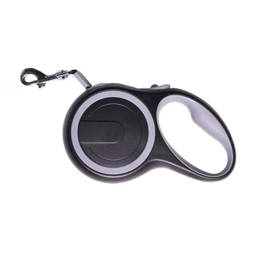 Retractable dog leash with automatic locking system for safe walking.

