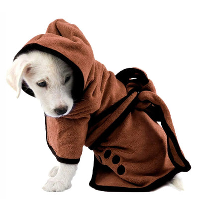 Small dog wearing a soft white bathrobe

